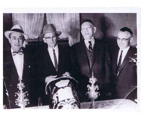 Posing for pictures before placing the torah into the ark.  Were you there to witness this event?